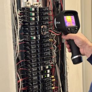 Home inspection testing the electrical breakers