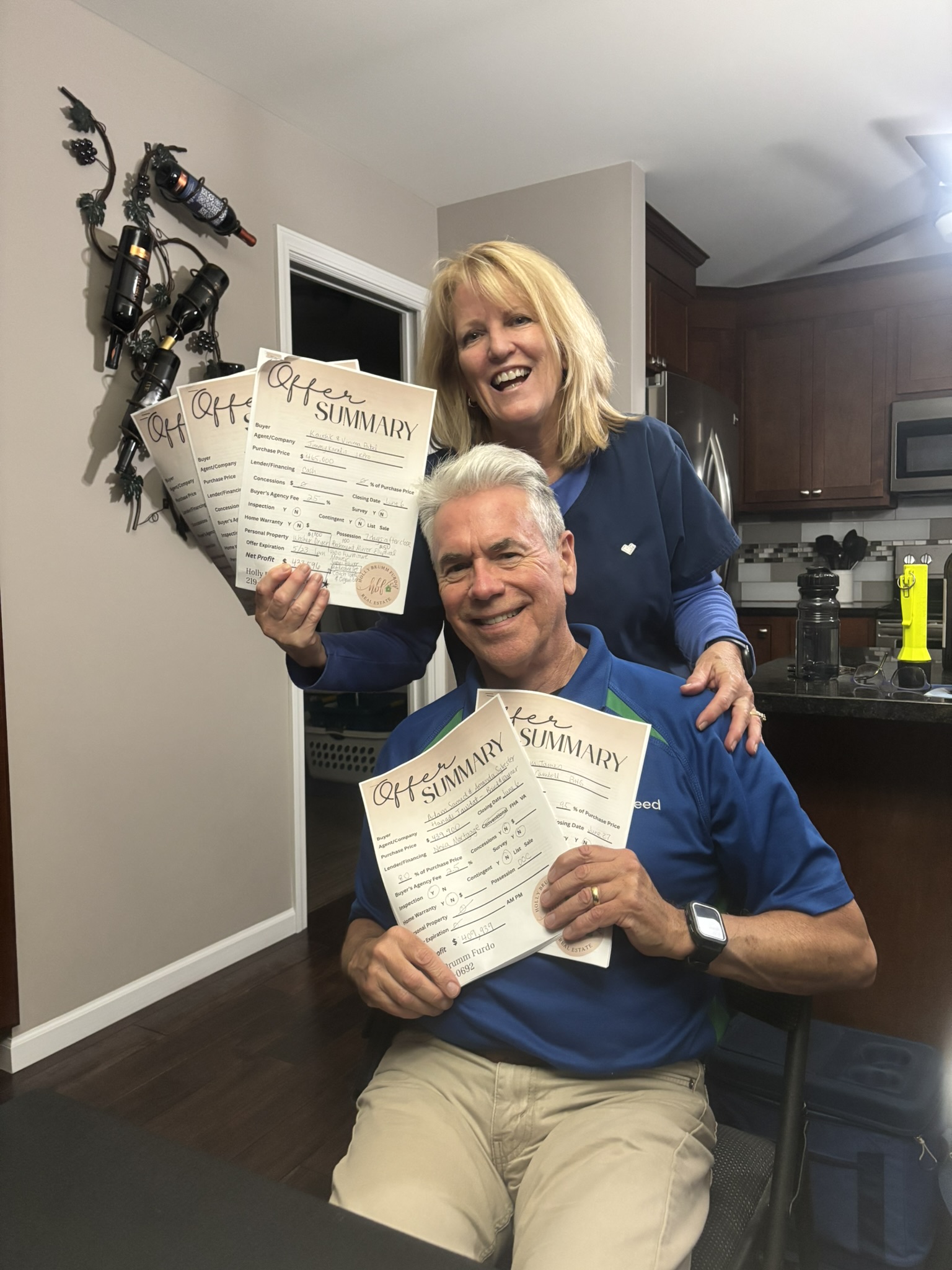Holly Brumm Furdo with happy home sellers holding 5 offers!